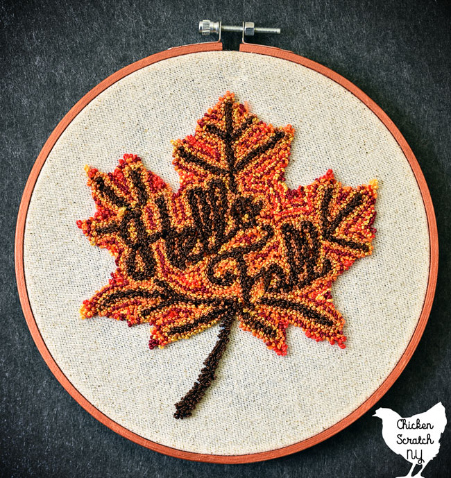 multicolored punch needle autumn leaf with HEllow fall embroidered in the center